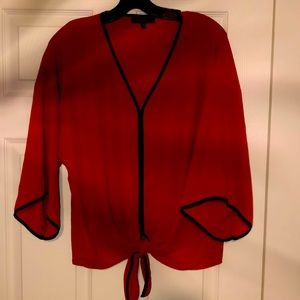 Size Small Melissa Paige Burnt Orange sheer Blouse with Black Detail Trim.